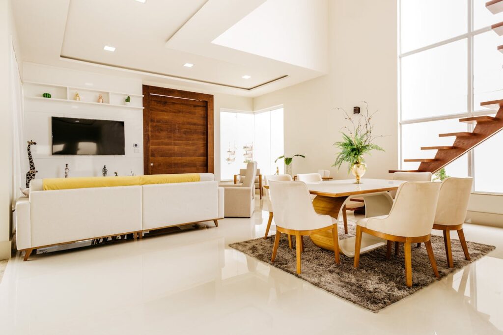 Modern interior of modern living room with second level space in minimalistic design in white color with wooden elements